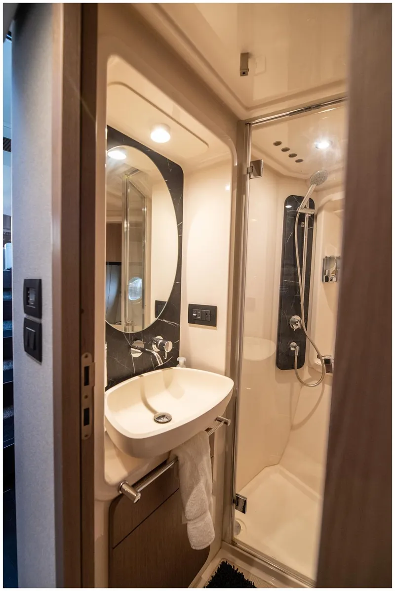 Slide: The Image of Luxurious bathroom in 2022 Azimut Fly yacht with modern fixtures and elegant design. - 54