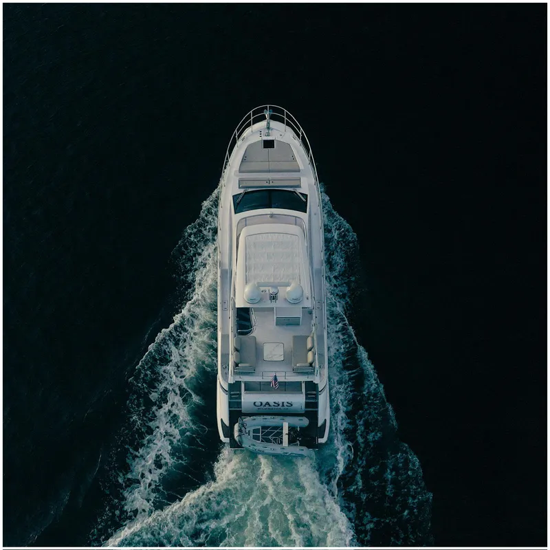 Slide: The Image of Aerial view of 2022 Azimut Fly yacht cruising on dark water. - 7