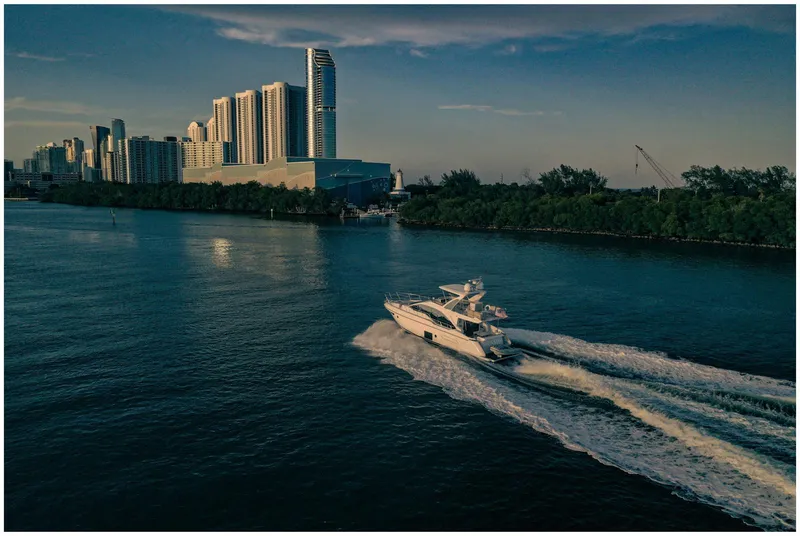 Slide: The Image of Azimut 50 Fly yacht cruising near city skyline, 2022 model. - 8