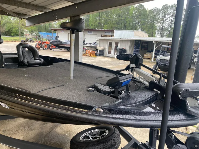 Slide: The Image of 2022 Nitro Z20 Pro bass boat on trailer, parked under shelter. - 2