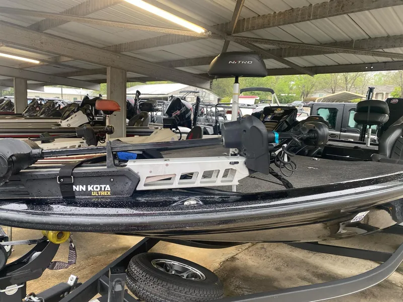 Slide: The Image of 2022 Nitro Z20 Pro boat with Minn Kota Ultrex motor in covered storage. - 3