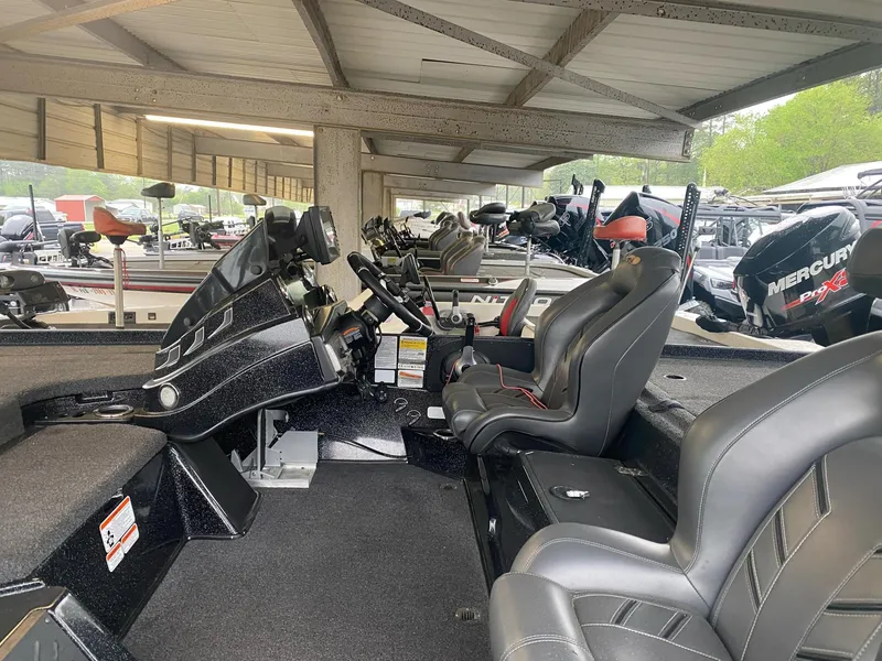 Slide: The Image of 2022 Nitro Z20 Pro boat interior with sleek black seating and modern dashboard. - 7