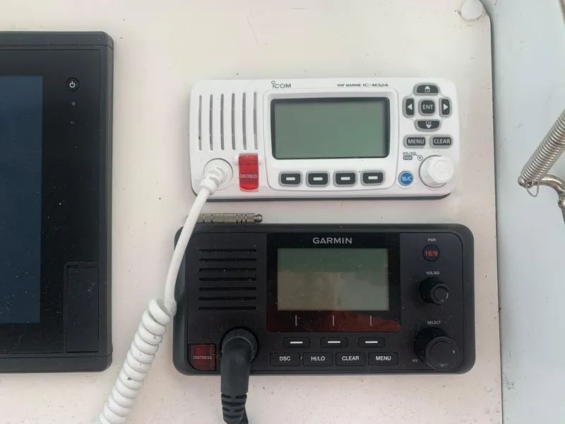 Slide: The Image of Control panel with Icom and Garmin marine radios on a 1998 Hatteras 52 Cockpit Motor Yacht. - 12