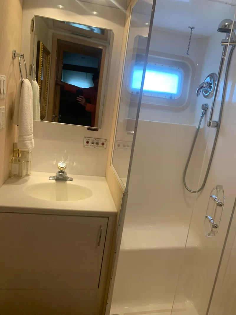 Slide: The Image of Bathroom interior of 1998 Hatteras 52 Cockpit Motor Yacht with shower and sink. - 26