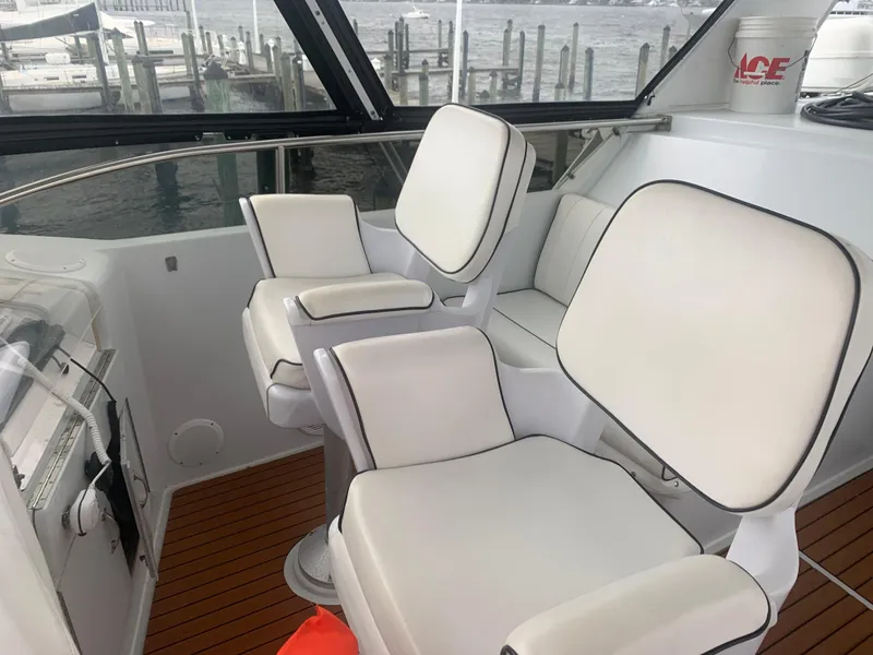 Slide: The Image of Luxurious seating on 1998 Hatteras 52 Cockpit Motor Yacht with waterfront view. - 5