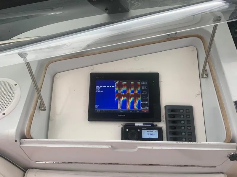 Slide: The Image of Control panel of a 1998 Hatteras 52 Cockpit Motor Yacht with navigation equipment. - 9