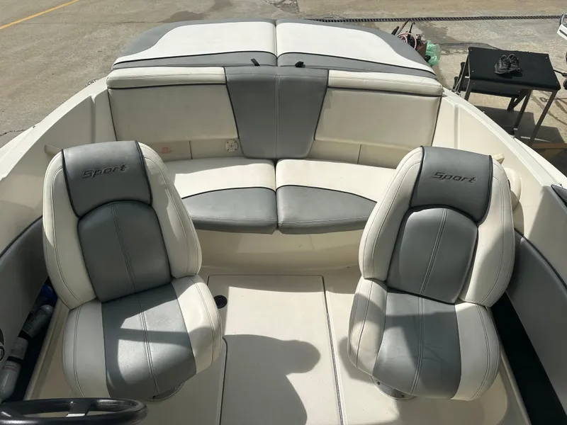 Slide: The Image of 2008 Sea Ray 185 Sport boat interior with gray and white seating. - 4