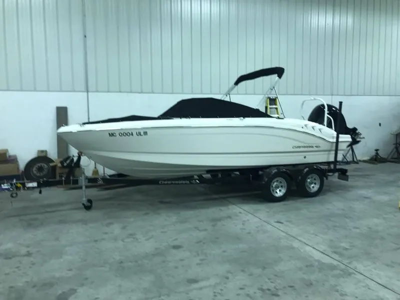 Slide: The Image of 2020 Chaparral 21 SSi OB boat on trailer in indoor storage facility. - 0