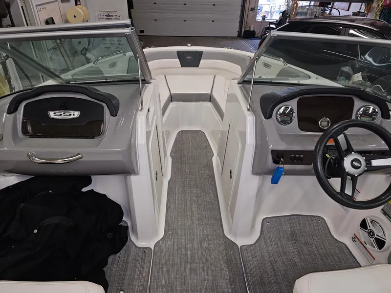 Slide: The Image of 2020 Chaparral 21 SSi OB boat interior with dual consoles and steering wheel. - 10