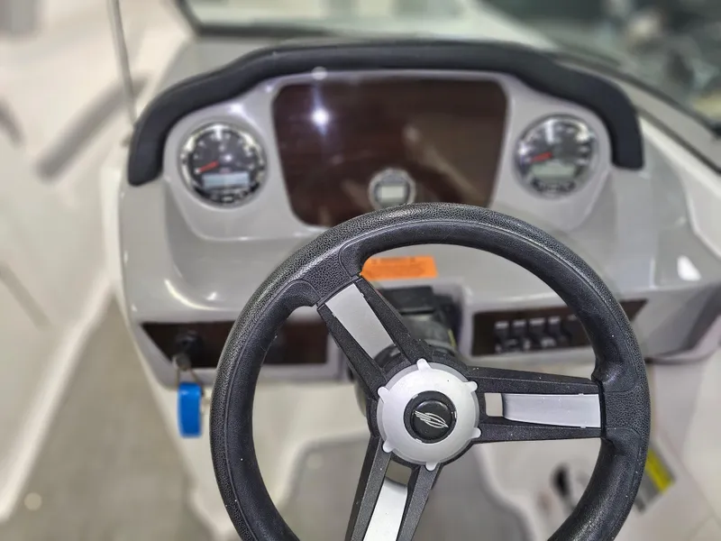 Slide: The Image of Steering wheel and dashboard of 2020 Chaparral 21 SSi OB boat. - 12