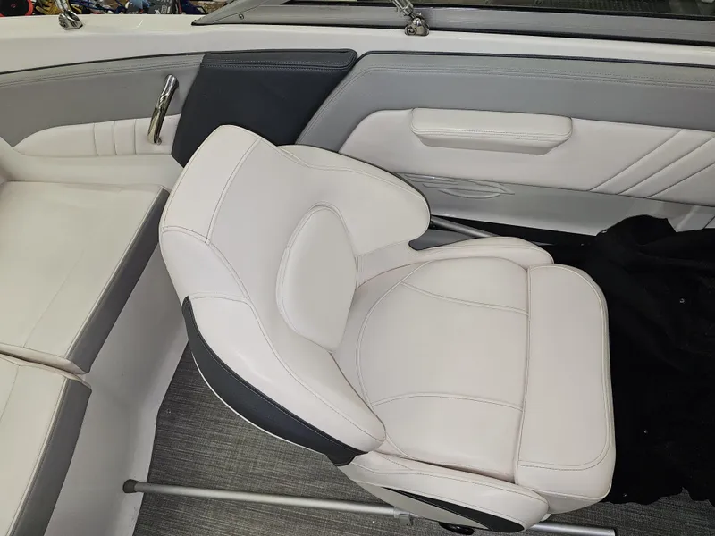 Slide: The Image of 2020 Chaparral 21 SSi OB boat interior with white and gray seating. - 15