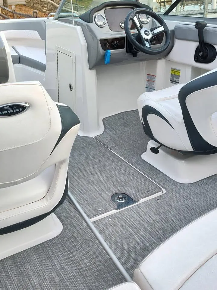 Slide: The Image of 2020 Chaparral 21 SSi OB boat interior with modern seating and steering console. - 16