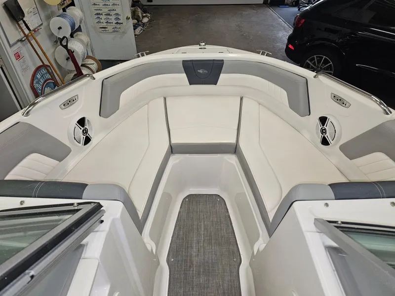 Slide: The Image of Interior of 2020 Chaparral 21 SSi OB boat with white and gray seating. - 18
