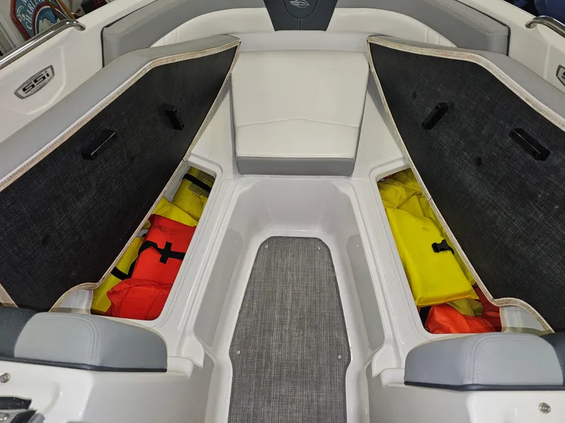 Slide: The Image of Interior of 2020 Chaparral 21 SSi OB boat with open storage compartments. - 19