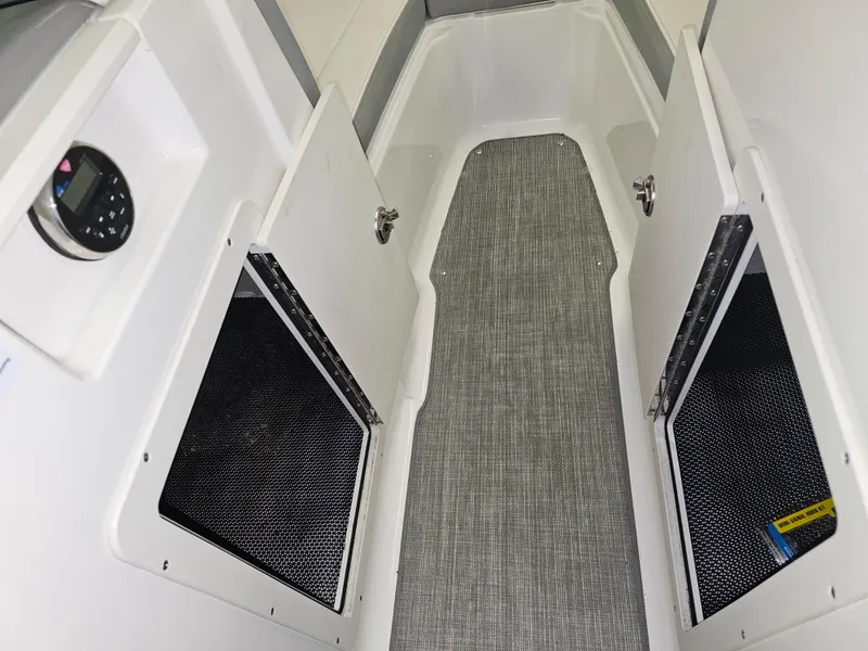 Slide: The Image of Interior storage compartments of a 2020 Chaparral 21 SSi OB boat. - 20