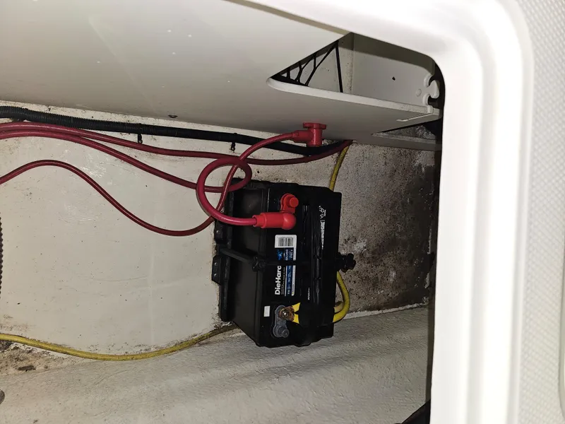 Slide: The Image of Battery compartment of 2020 Chaparral 21 SSi OB with wiring connections. - 23