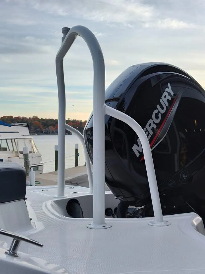 Slide: The Image of 2020 Chaparral 21 SSi OB boat with Mercury outboard motor at a marina. - 24