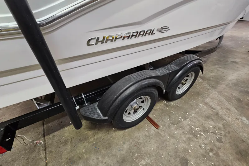 Slide: The Image of 2020 Chaparral 21 SSi OB boat on trailer, close-up of wheels and logo. - 26