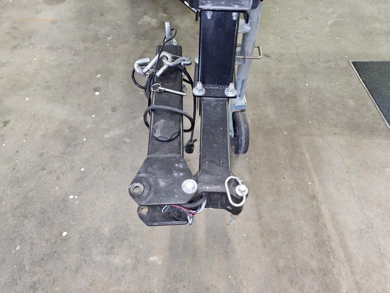 Slide: The Image of Trailer hitch of a 2020 Chaparral 21 SSi OB boat on concrete floor. - 27
