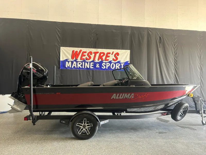Slide: The Image of 2024 Alumacraft Competitor FSX 185 boat displayed at Westre's Marine & Sport showroom. - 0