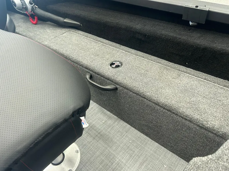 Slide: The Image of 2024 Alumacraft Competitor FSX 185 interior with gray carpet and seating detail. - 18