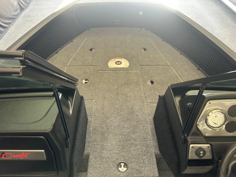 Slide: The Image of 2024 Alumacraft Competitor FSX 185 boat interior with spacious deck and storage compartments. - 5