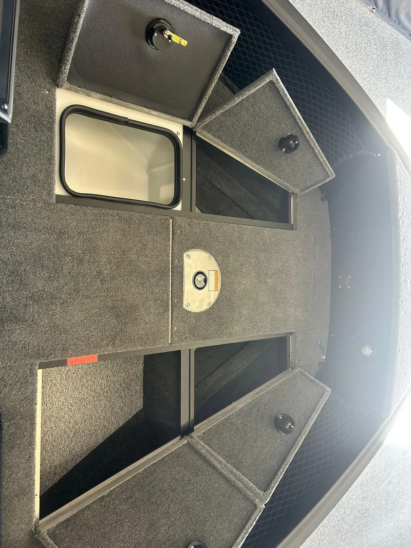 Slide: The Image of 2024 Alumacraft Competitor FSX 185 boat storage compartments, open and spacious design. - 7
