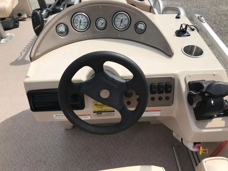 Slide: The Image of Steering console of 2010 Weeres Fisherman Deluxe 180 pontoon boat with gauges and controls. - 3
