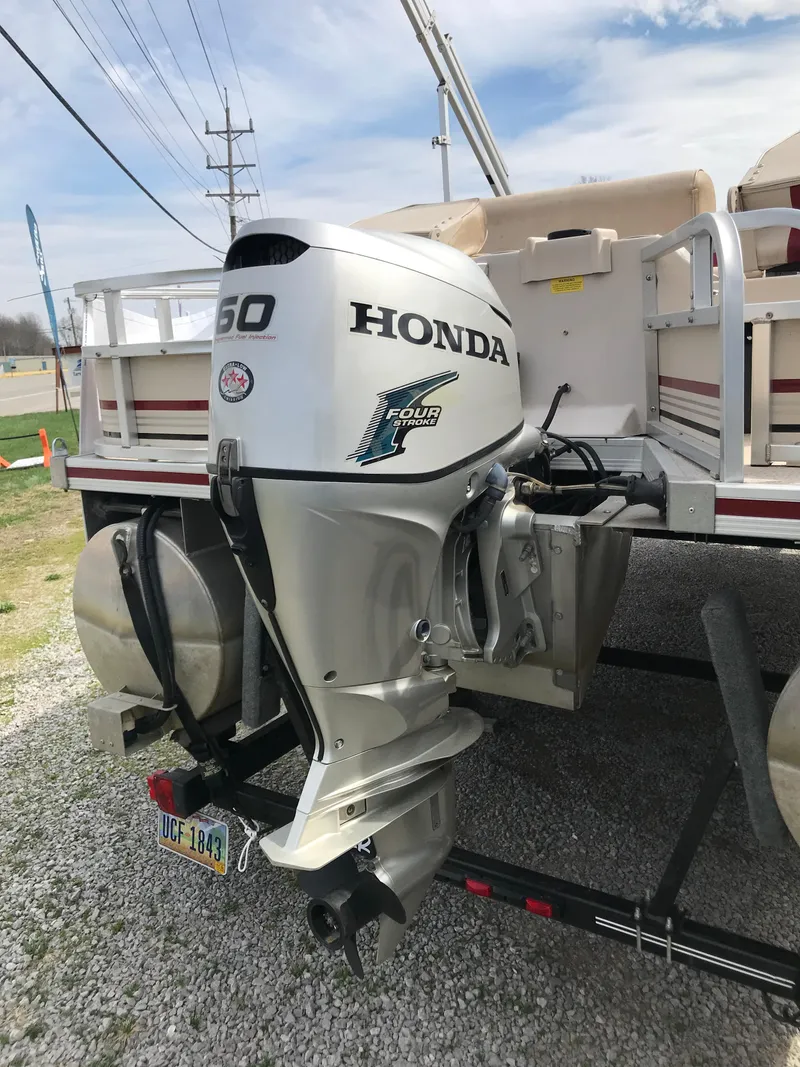 Slide: The Image of 2010 Weeres Fisherman Deluxe 180 with Honda 60 outboard motor on a trailer. - 8