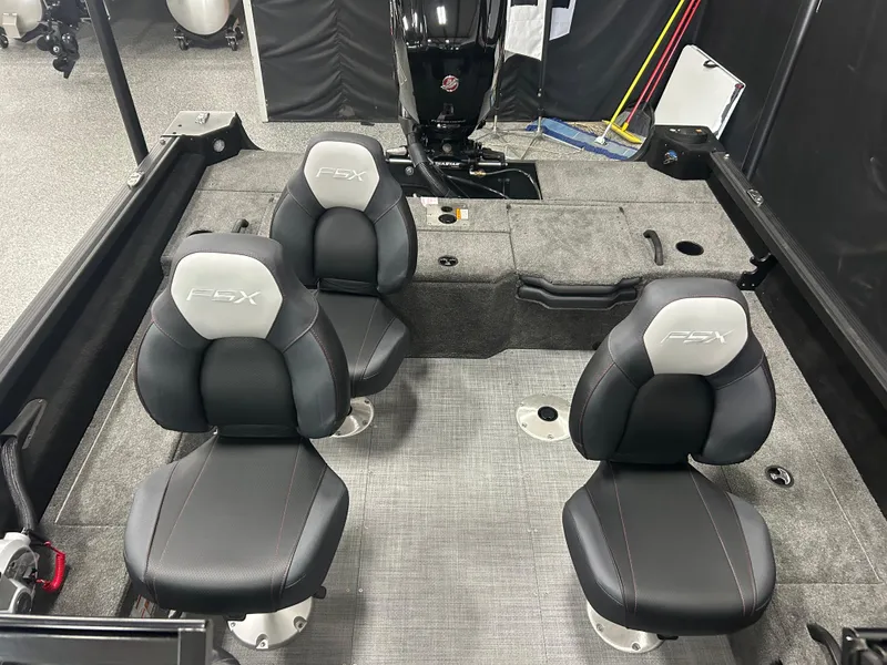 Slide: The Image of 2024 Alumacraft Competitor FSX 175 boat interior with two black and gray seats. - 14