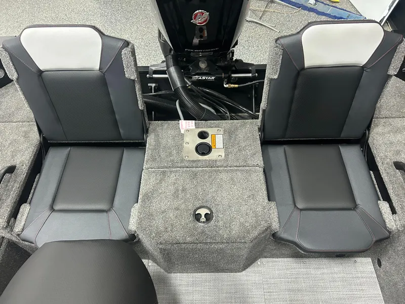Slide: The Image of 2024 Alumacraft Competitor FSX 175 boat interior with dual seats and motor controls. - 16