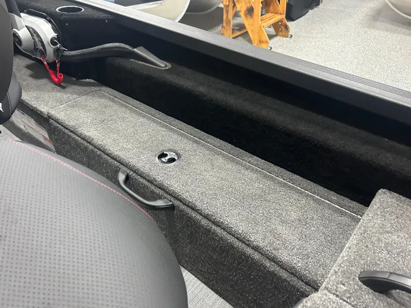 Slide: The Image of 2024 Alumacraft Competitor FSX 175 interior, featuring storage compartment and seating detail. - 20