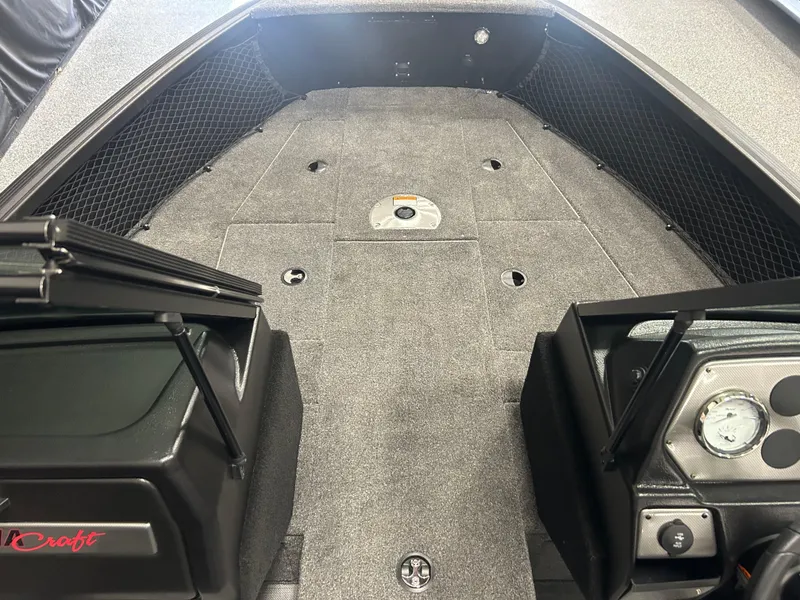 Slide: The Image of 2024 Alumacraft Competitor FSX 175 boat interior with spacious deck and storage compartments. - 7