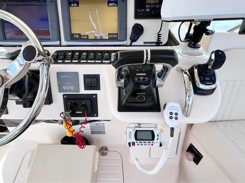 Slide: The Image of 2005 Grady-White Express 360 helm with navigation controls and electronic displays. - 14