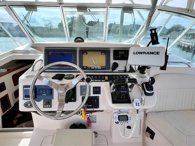 Slide: The Image of 2005 Grady-White Express 360 helm with advanced navigation and control systems. - 16