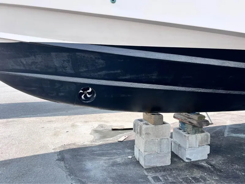 Slide: The Image of 2005 Grady-White Express 360 boat hull on blocks, showcasing propeller detail. - 3