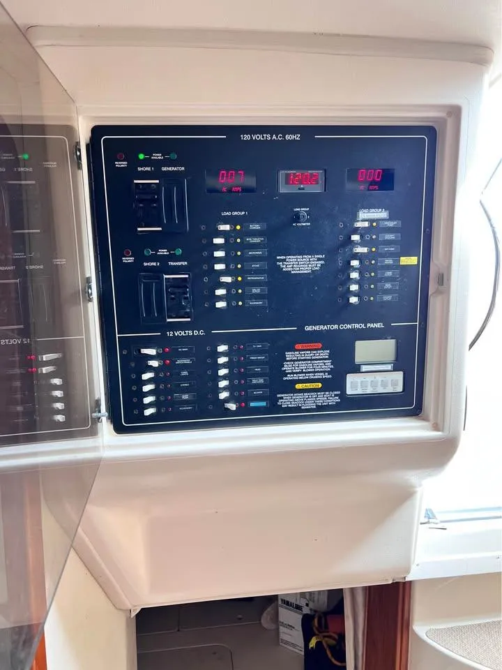 Slide: The Image of Electrical control panel on a 2005 Grady-White Express 360 boat. - 5
