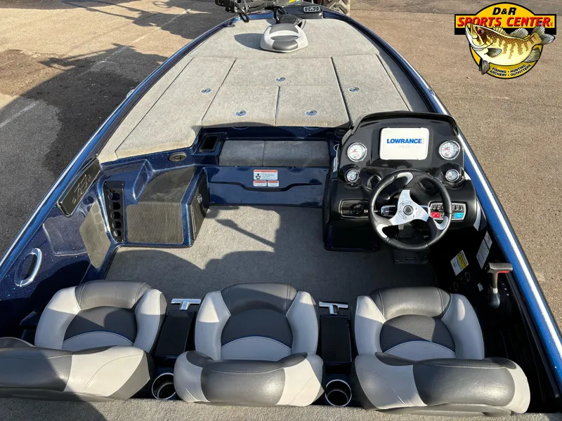 Slide: The Image of 2015 Nitro Z-9 boat interior with steering wheel and seating, featuring Lowrance electronics. - 6