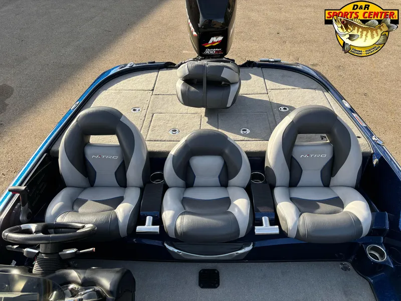 Slide: The Image of 2015 Nitro Z-9 boat interior with three gray seats and steering wheel. - 8