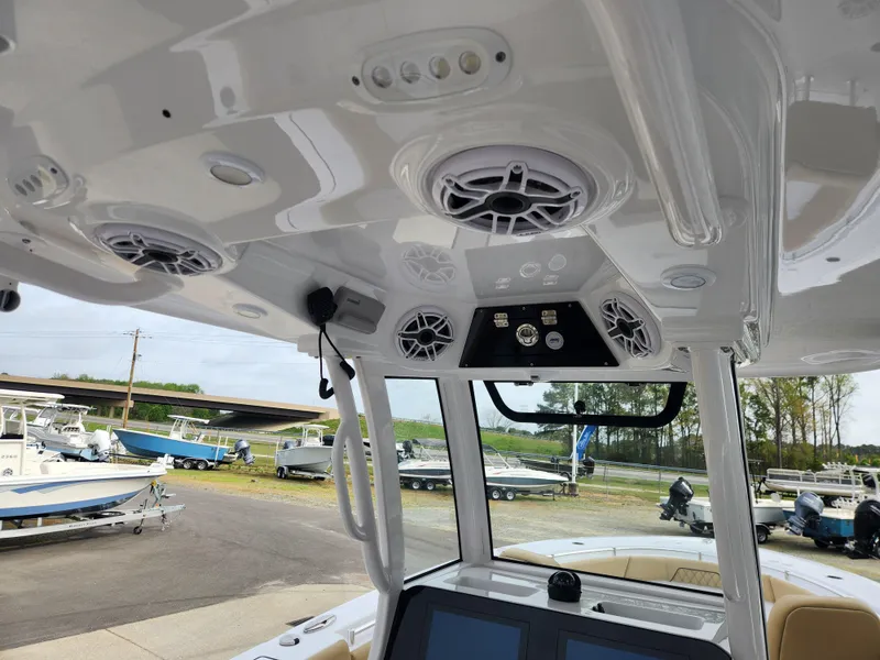 Slide: The Image of 2025 Sportsman Open 262 Center Console boat interior with speakers and control panel. - 21