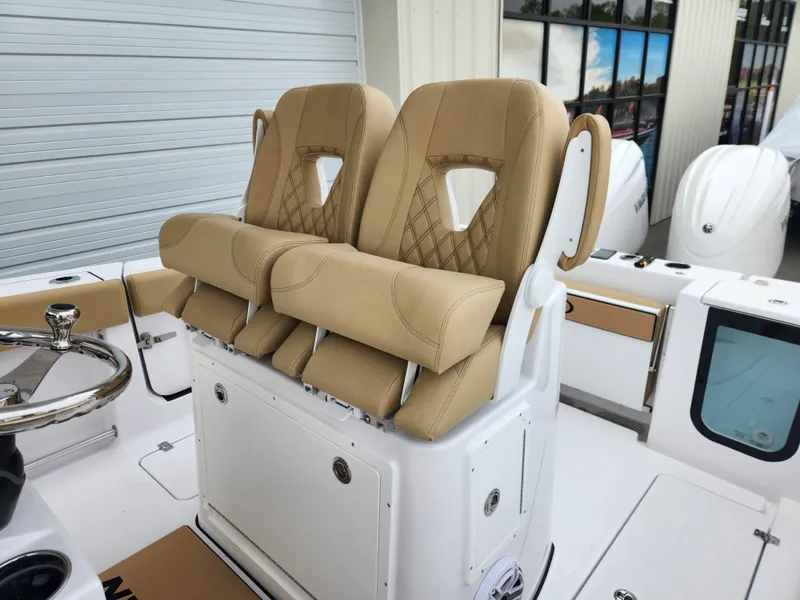 Slide: The Image of 2025 Sportsman Open 262 Center Console with tan cushioned seating and modern design. - 24