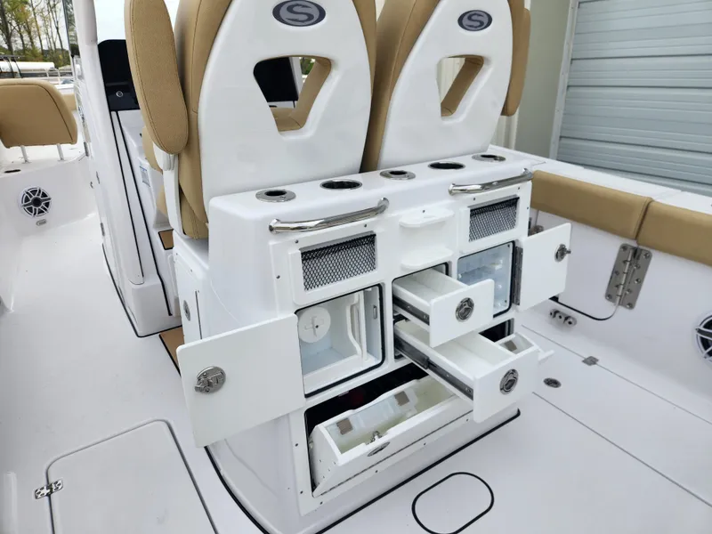 Slide: The Image of 2025 Sportsman Open 262 Center Console with storage drawers and seating in a sleek design. - 26