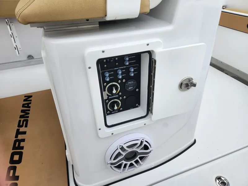 Slide: The Image of 2025 Sportsman Open 262 Center Console control panel with speaker and storage compartment. - 27