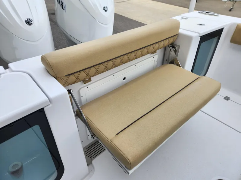 Slide: The Image of 2025 Sportsman Open 262 Center Console with beige cushioned seating. - 30