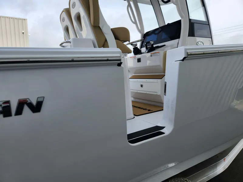 Slide: The Image of 2025 Sportsman Open 262 Center Console boat with sleek seating and modern design. - 33