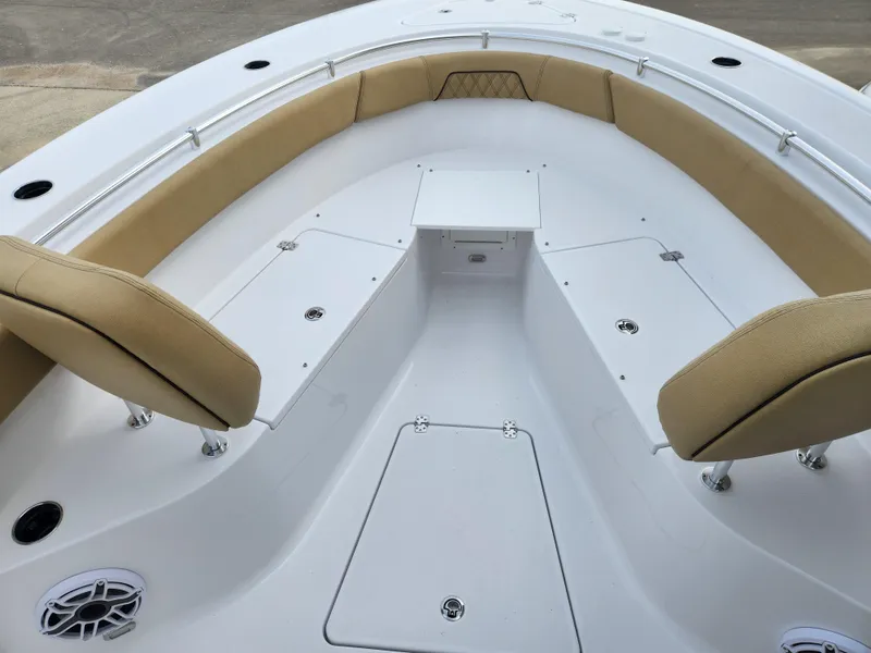 Slide: The Image of 2025 Sportsman Open 262 Center Console boat interior with cushioned seating and storage compartments. - 7