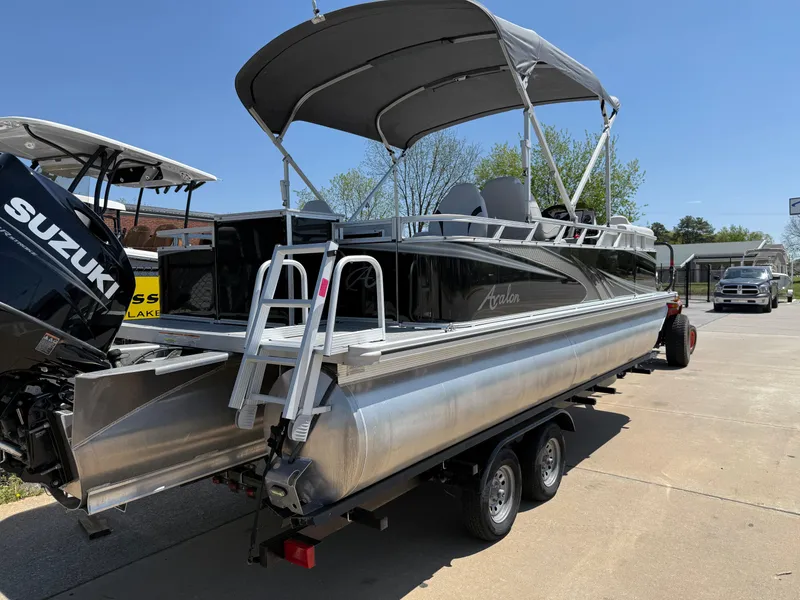 Slide: The Image of 2022 Avalon Venture Fish pontoon boat with Suzuki outboard motor on trailer. - 22