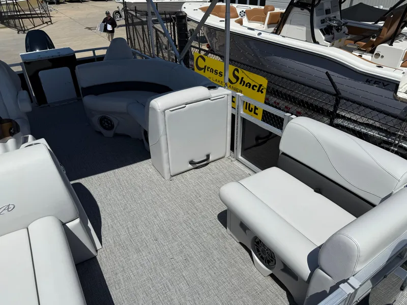 Slide: The Image of 2022 Avalon Venture Fish pontoon boat interior with gray seating and carpet. - 34