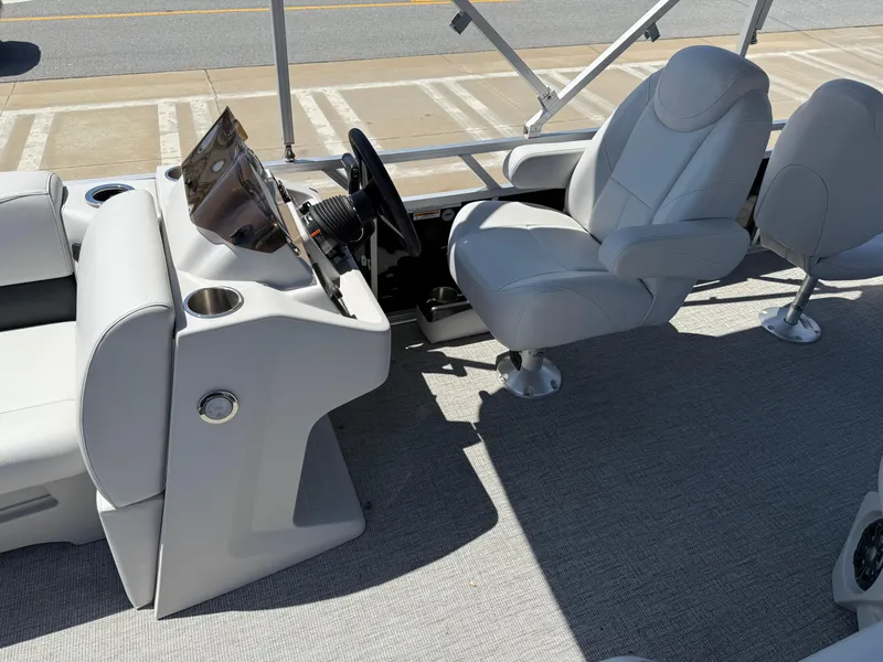 Slide: The Image of 2022 Avalon Venture Fish boat interior with steering console and comfortable seating. - 36