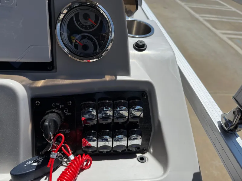 Slide: The Image of Control panel of 2022 Avalon Venture Fish boat with switches and gauges. - 40